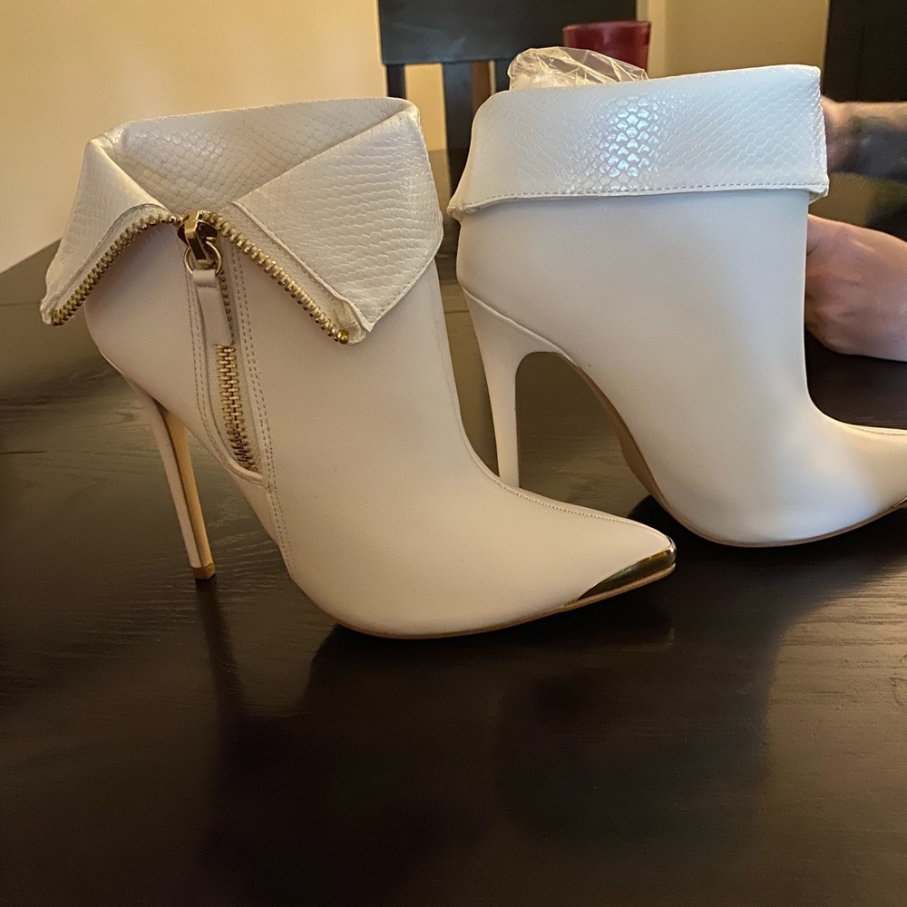 Brand new white boots.